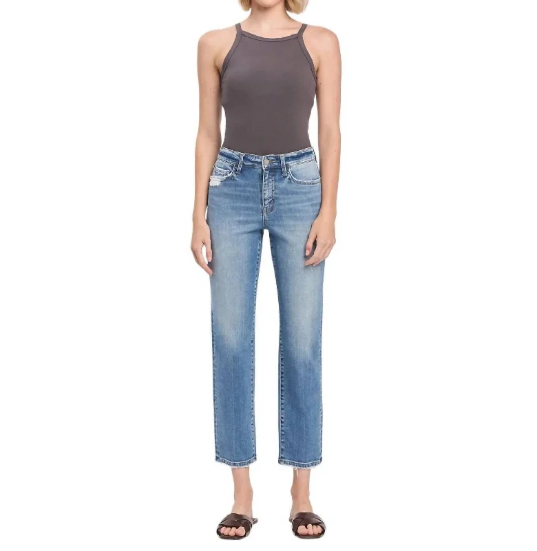 Ripped women jeans for a rebellious and fashion - forward styleHigh Rise Tapered Straight Jeans In Light Denim